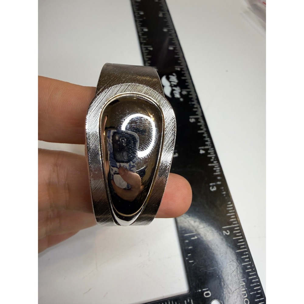 Silver Tone Textured Bypass Hinged Cuff Bracelet with Safety Chain Statement